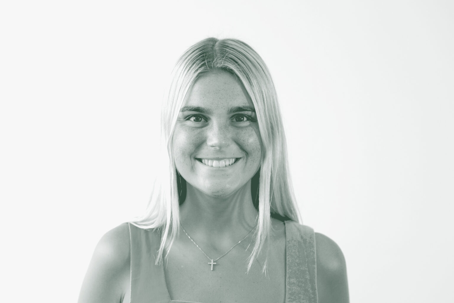 A black and white portrait of Jacqueline Sullivan, an Interior Design Professional with GFF in the Interior Design Studio, in front of a white background.