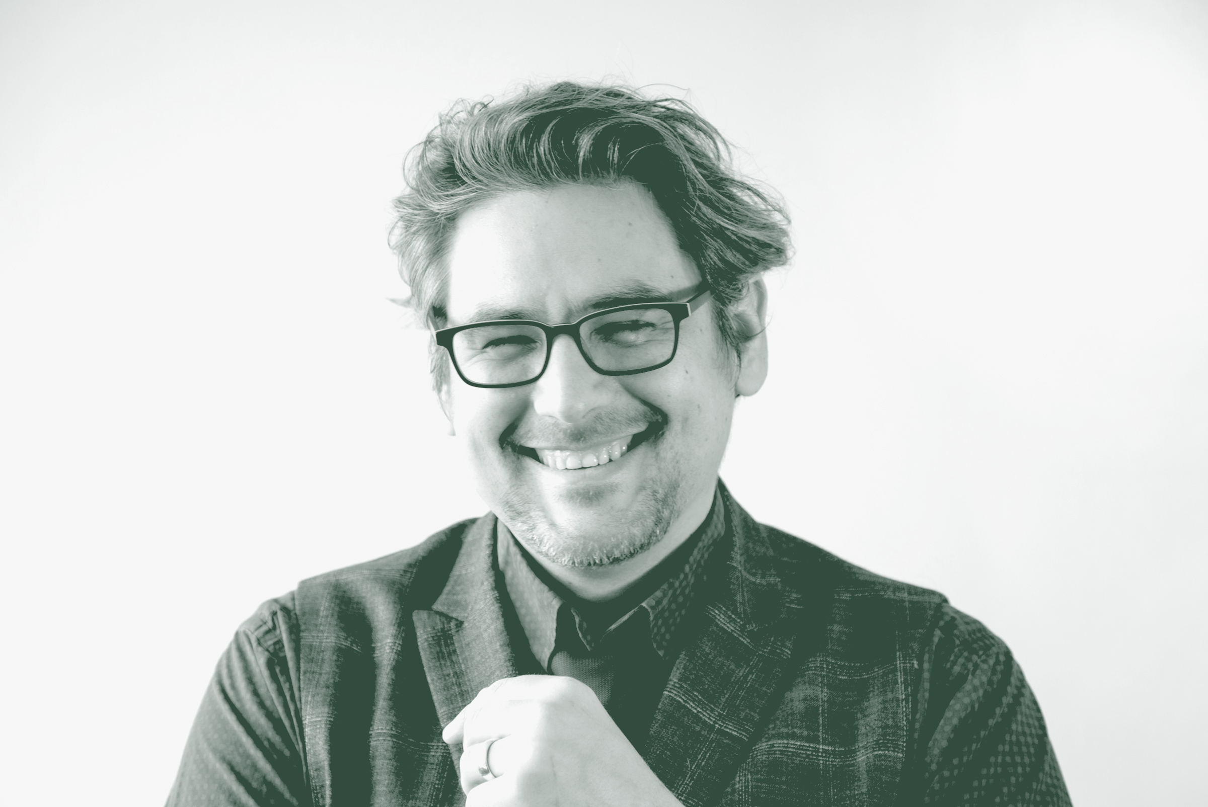 Jason Fedors Portrait A black and white portrait of Jason Fedors, a Planning Leader with GFF in the Planning Studio, in front of a white background.