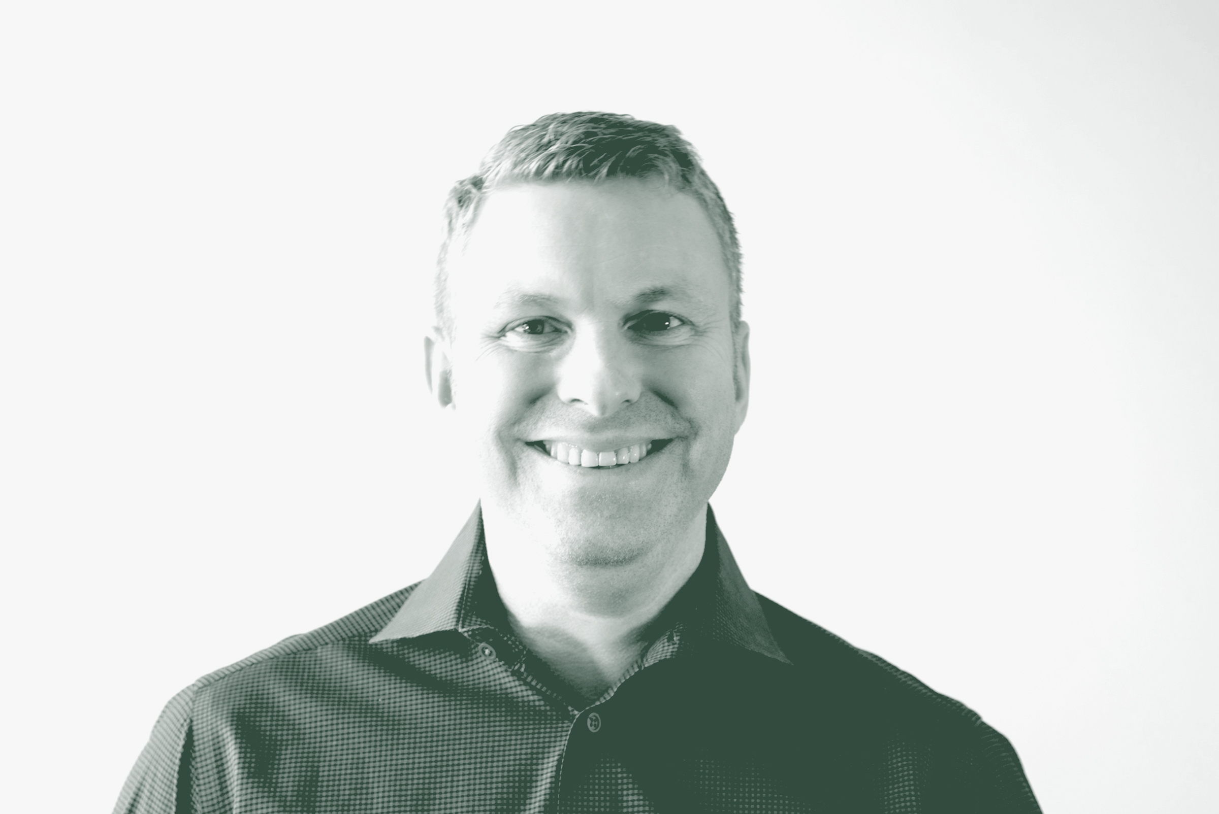 A black and white portrait of Joshua Brown, a Senior Project Coordinator with GFF in the Mixed-Use & Multifamily Studio, in front of a white background.