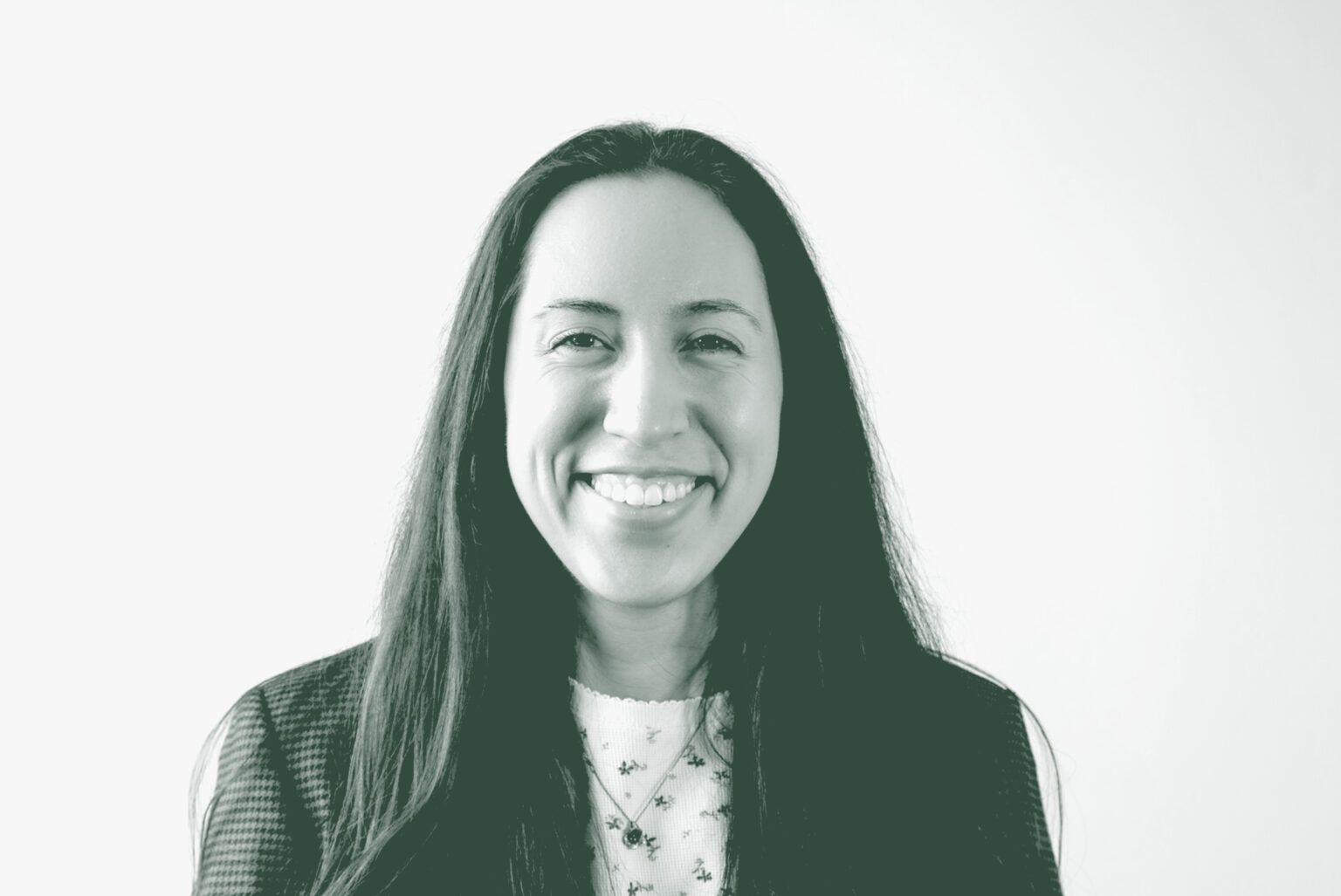 A black and white portrait of Marisa Dominguez, an Architectural Professional with GFF in the Mixed-Use & Multifamily Studio, in front of a white background.