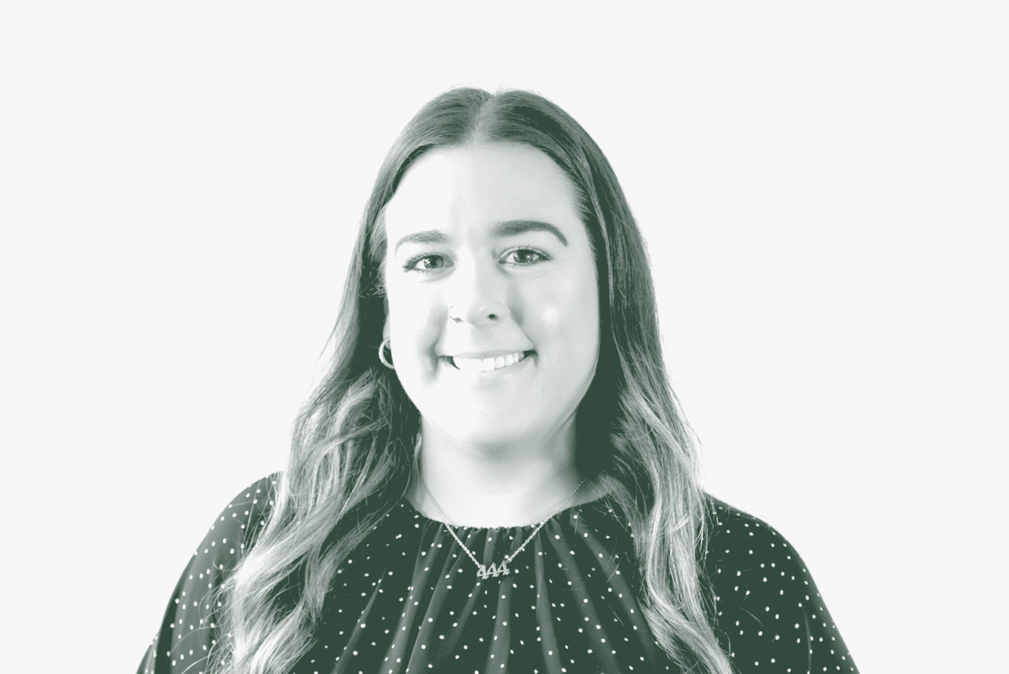 A black and white portrait of Maya Pavon, an Architectural Professional with GFF in the Retail & Hospitality Studio, in front of a white background.