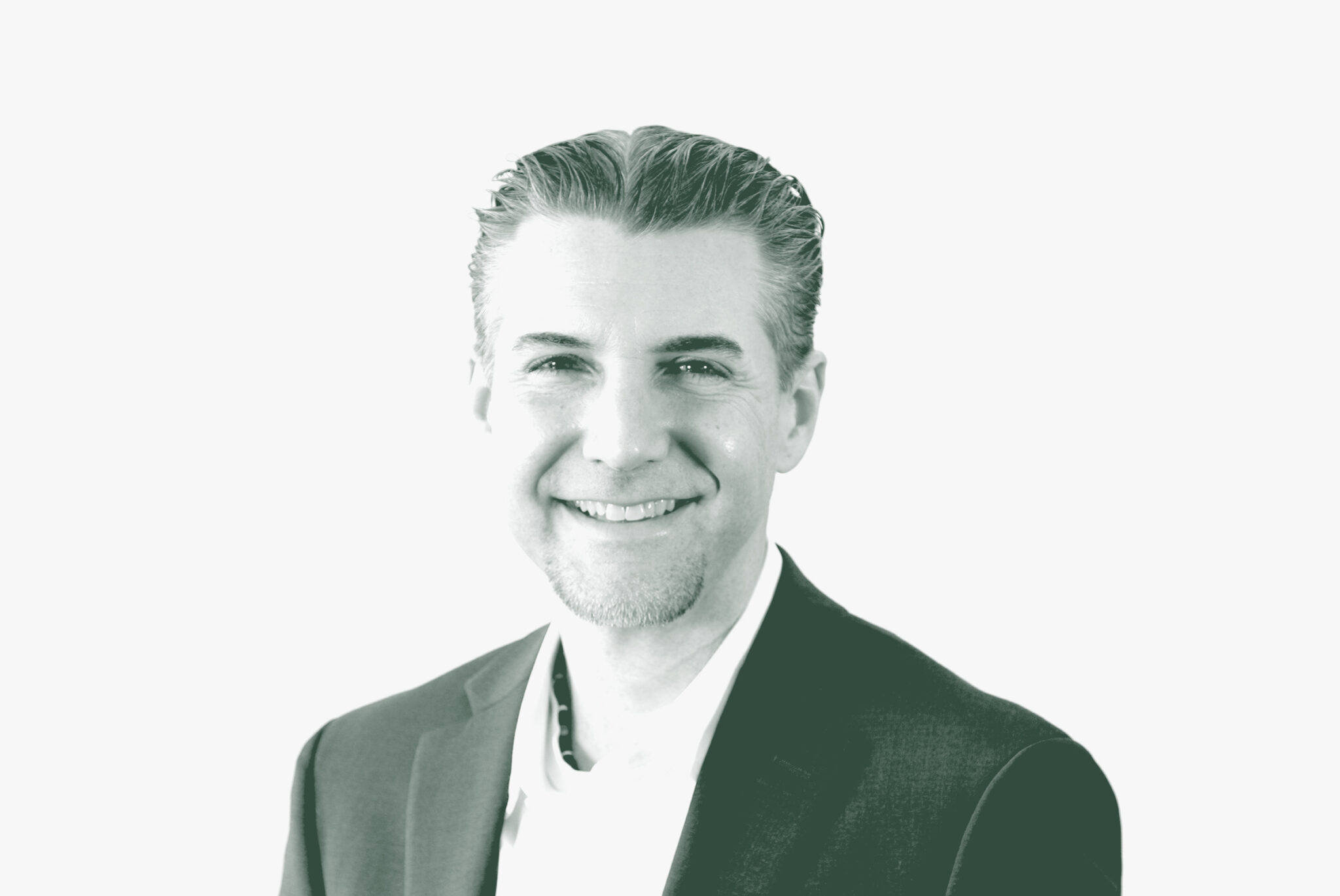 A black and white portrait of Rocky Owens, a Project Leader with GFF in the Office & Workplace Studio, in front of a white background.