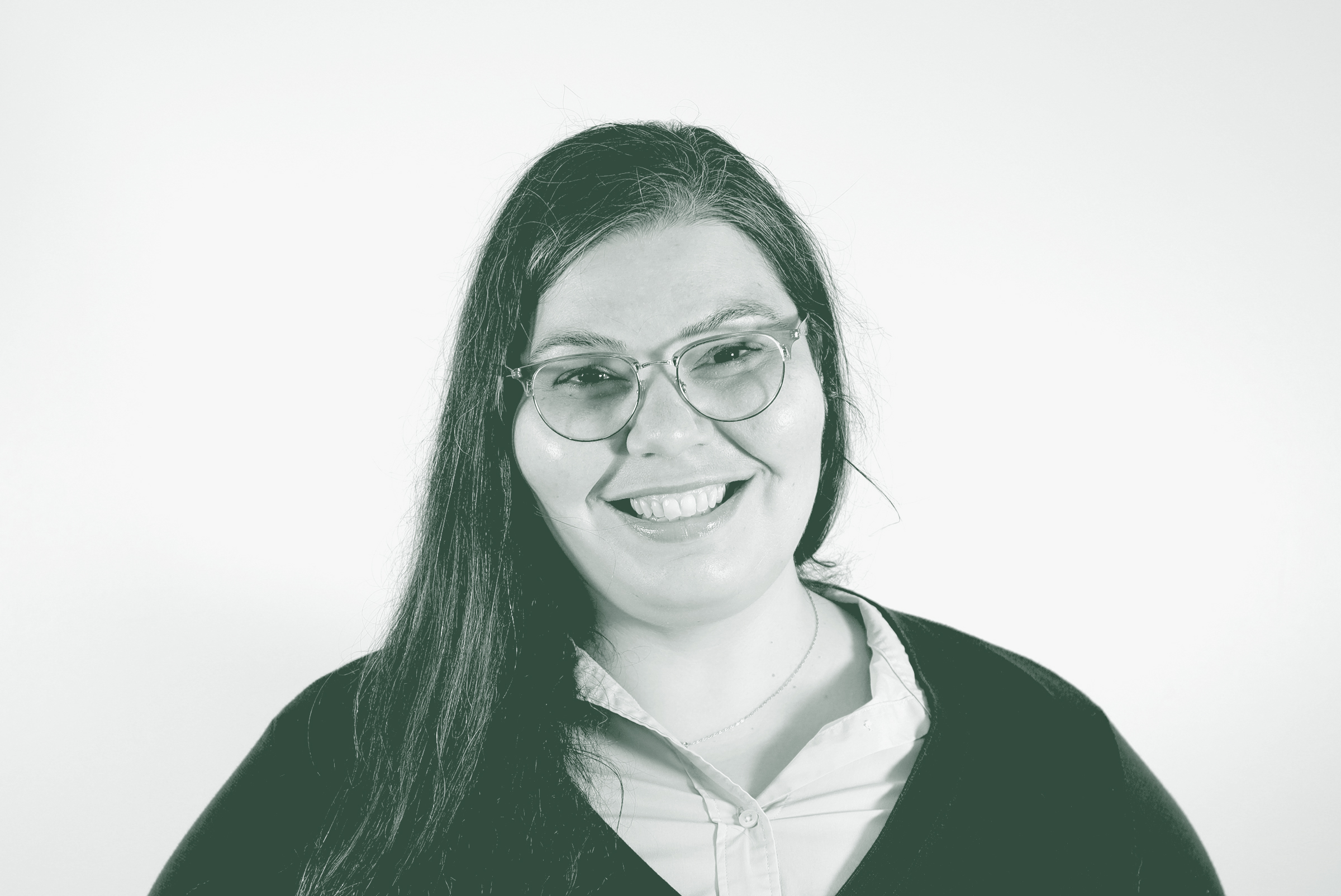 A black and white portrait of Sarah Hamzeh, an Associate and Project Leader with GFF in the Fort Worth Studio, in front of a white background.