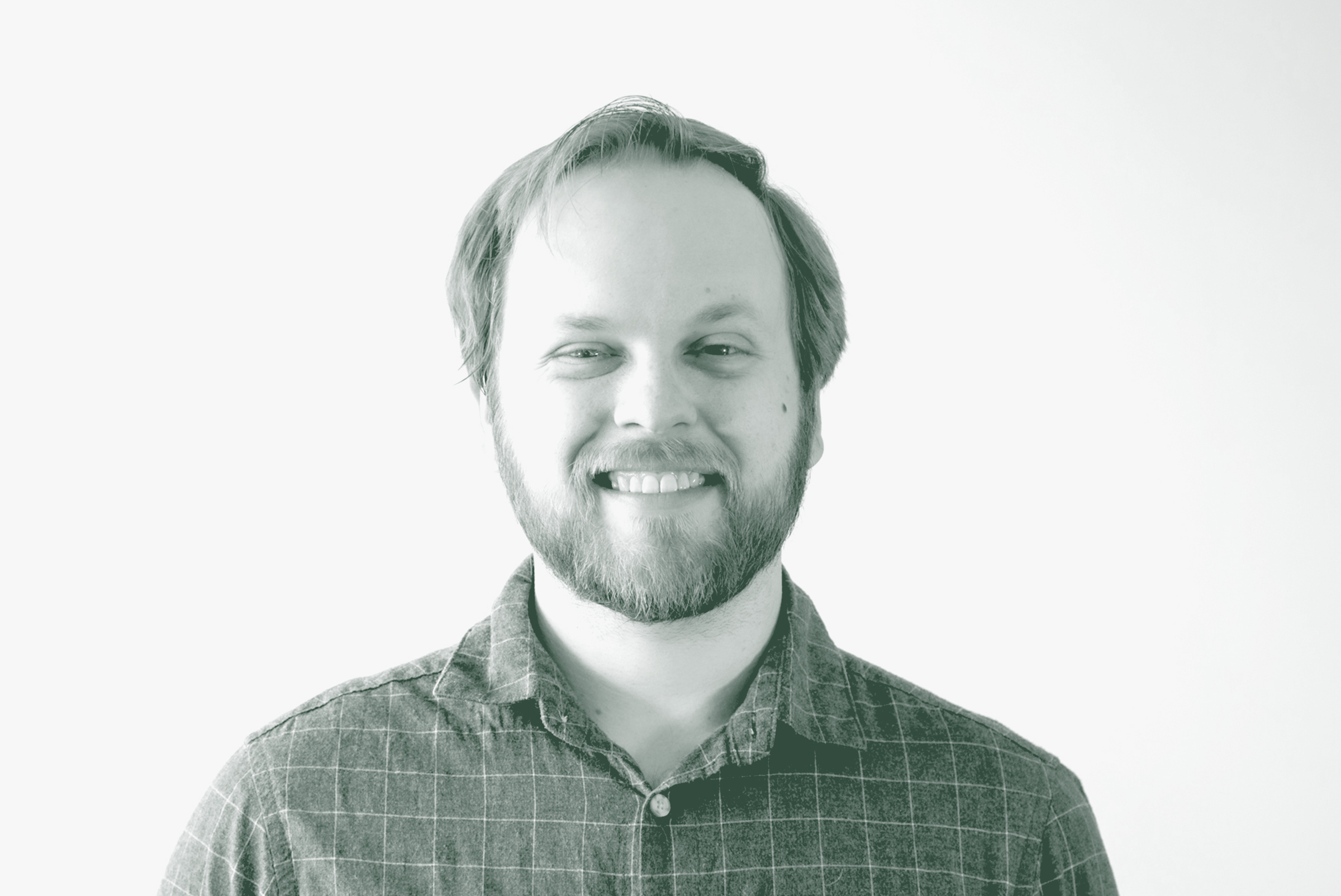 Talon McCart Portrait A black and white portrait of Talon McCart, a Senior Project Coordinator with GFF in the Mixed-Use & Multifamily Studio, in front of a white background.
