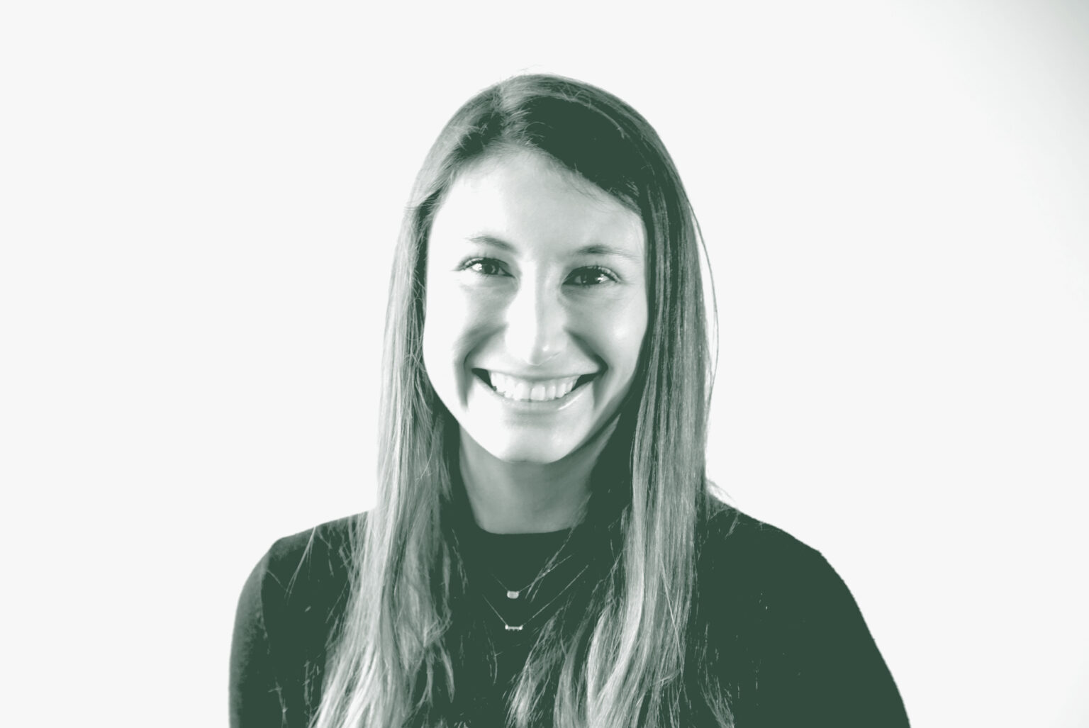 A black and white portrait of Taylor Wade, a Senior Design Technology Coordinator with GFF, in front of a white background.