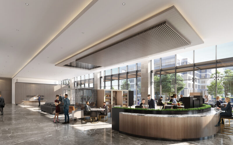 Lobby with seating area, reception desk, and people interacting.