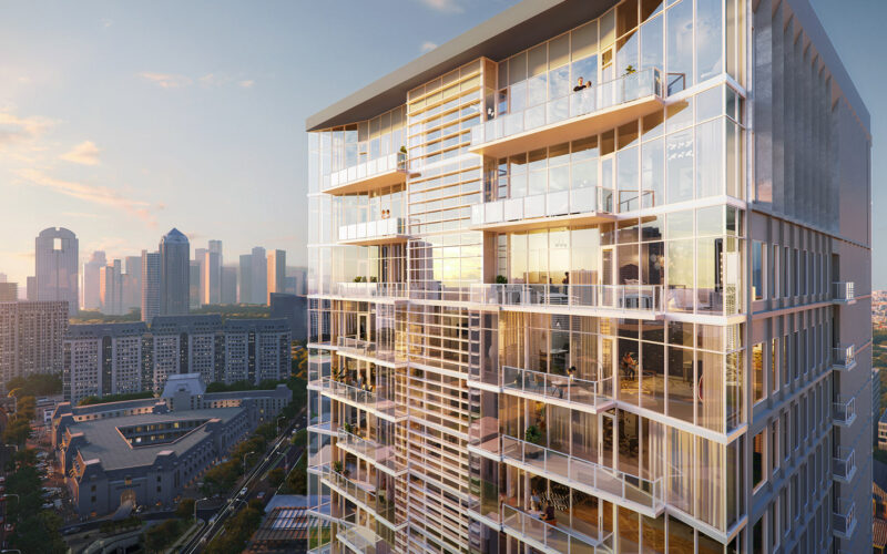 Close-up of the upper floors of the luxury residential tower, focusing on the expansive glass windows and balconies of the penthouses with views of Dallas.
