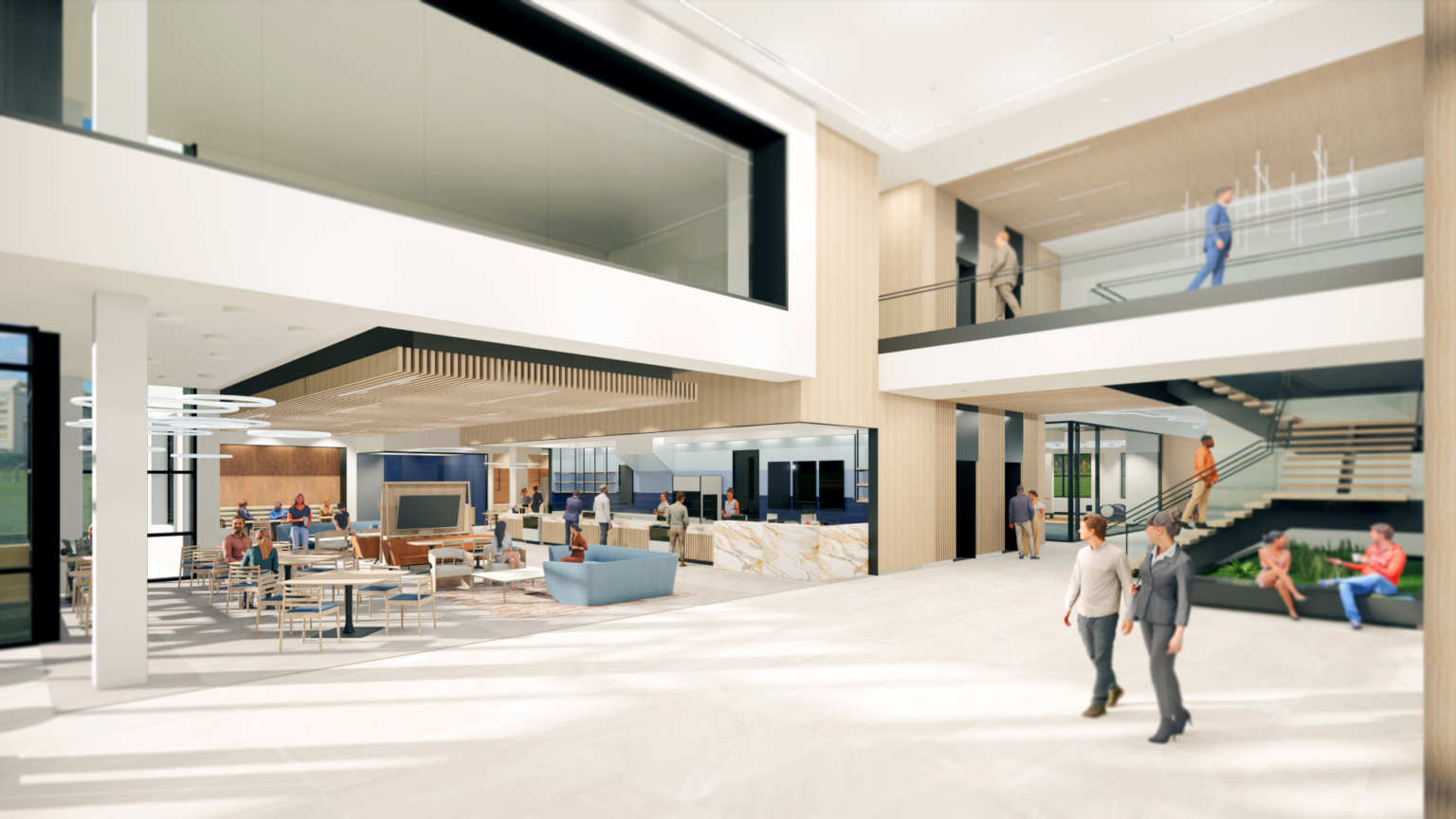 Spacious and bright corporate lobby with modern furnishings and an open stairwell leading to the second floor.