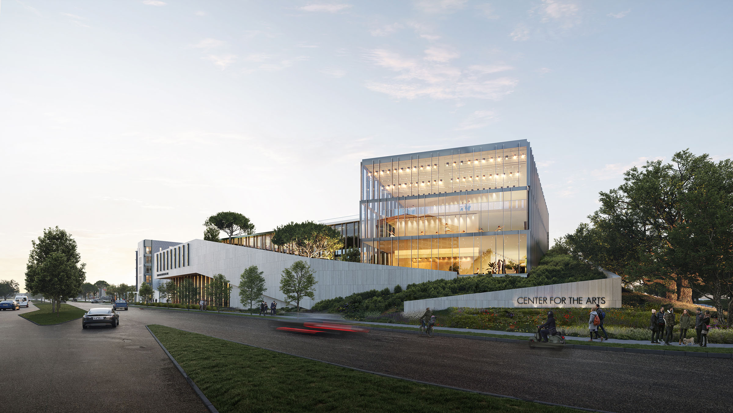 Street-level view of the Center for the Arts from the corner, showing the building's modern façade and surrounding greenery.