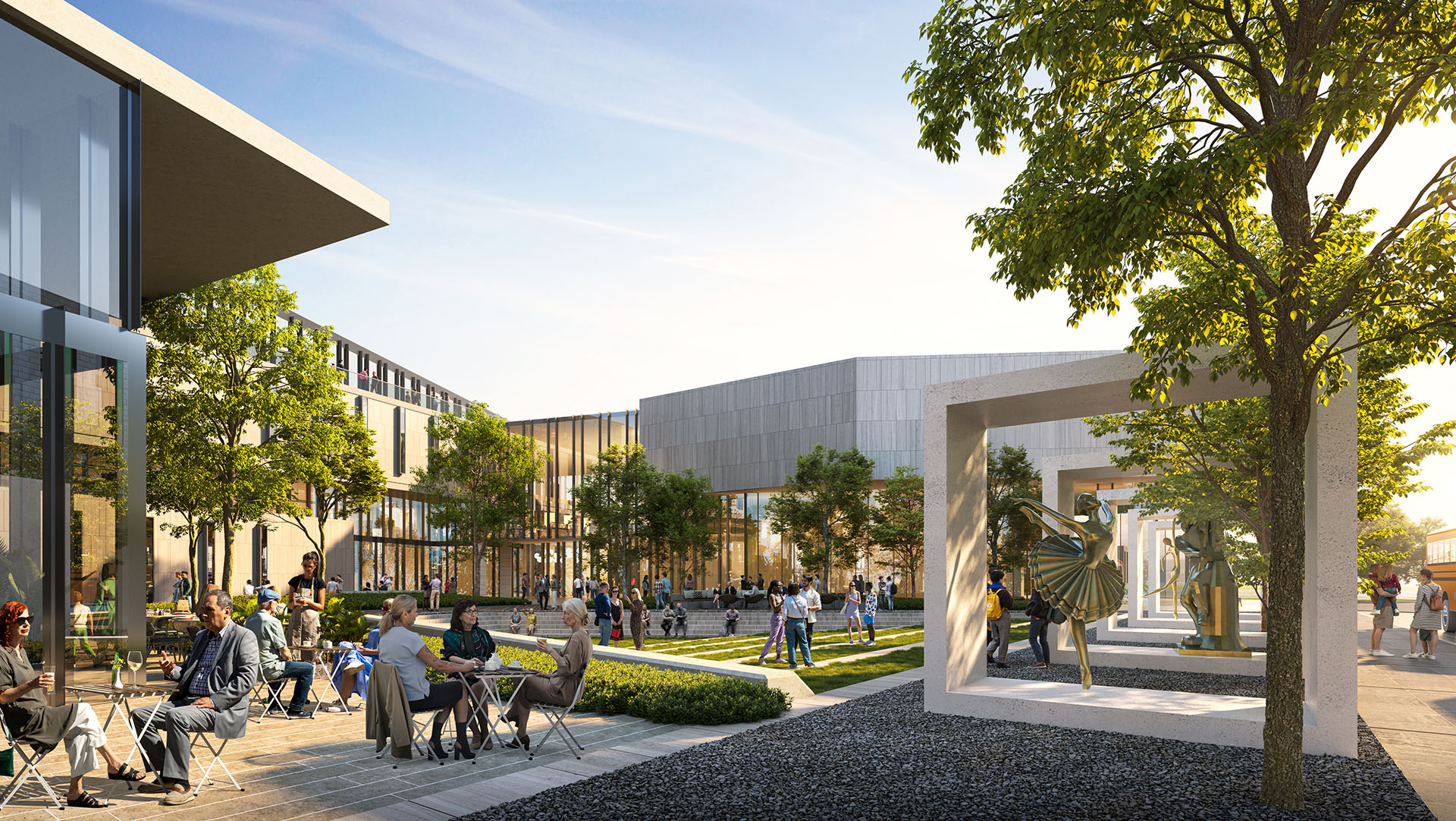 Outdoor café seating area in a vibrant courtyard, surrounded by modern architectural elements and greenery.