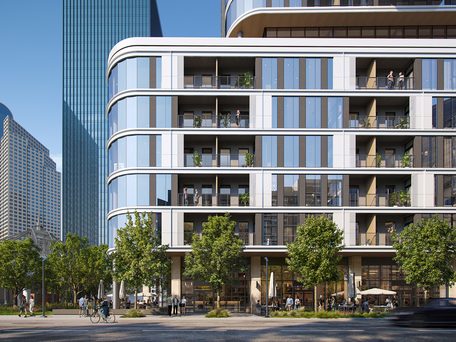 Close-up of the facade of Empira 711 N Pearl, highlighting the building’s grid pattern of glass and metal panels, with balconies overlooking the street below.