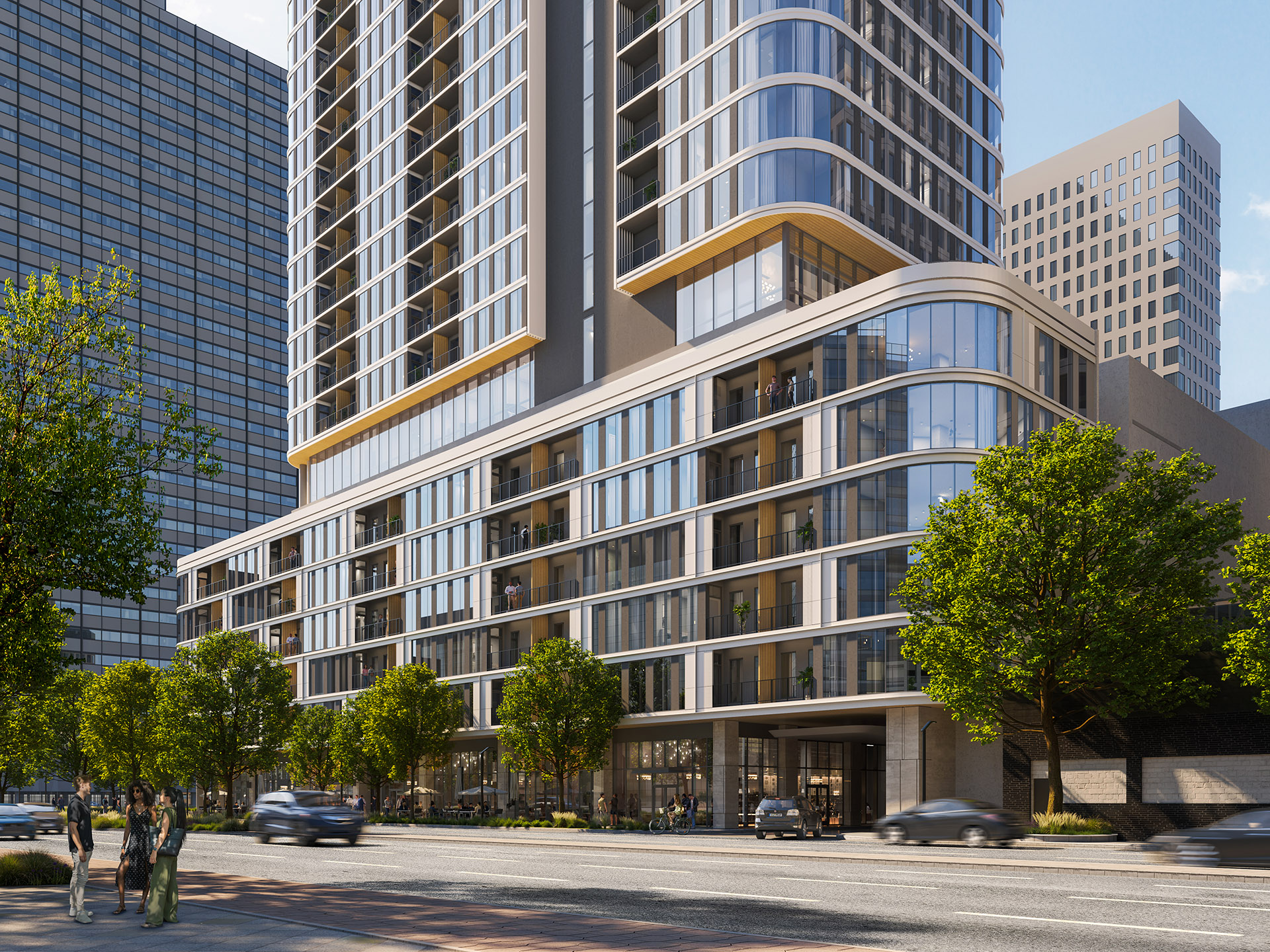 Street-level view of Empira 711 N Pearl during the day, with the lower floors' extensive glass windows and surrounding trees framing the building.