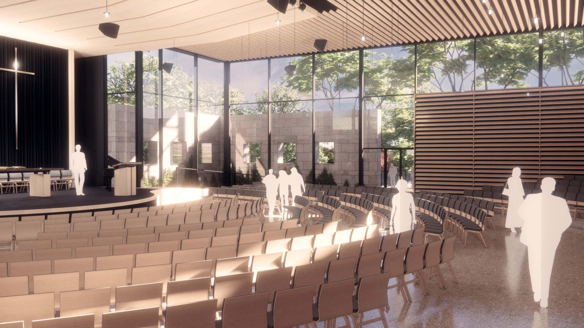 Interior view of Concordia University Chapel, showing rows of seating and a glass wall that opens up to the outdoor landscape.