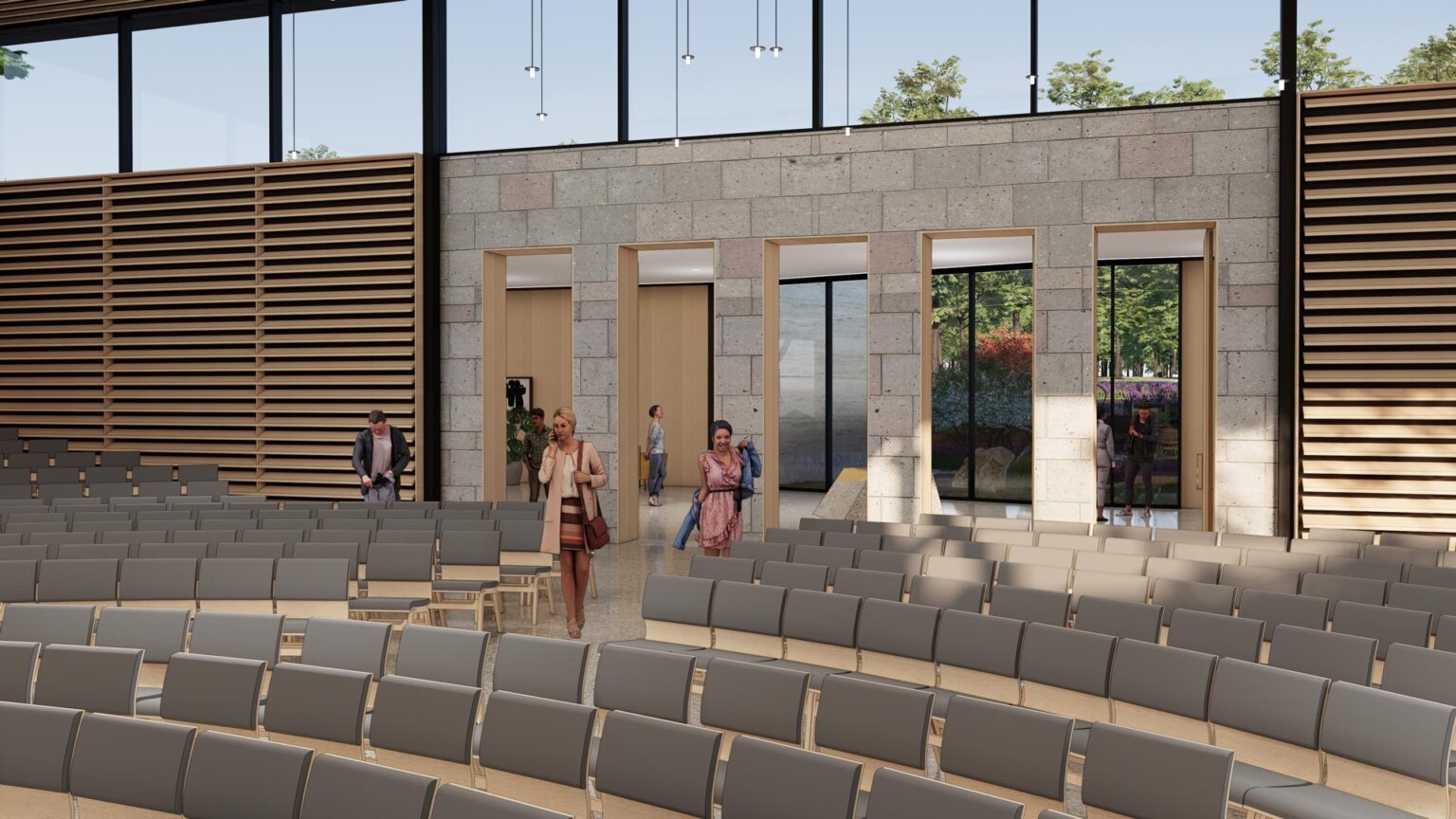 Interior view from within the Chapel looking back at stone wall with multiple doors and windows to the narthex.