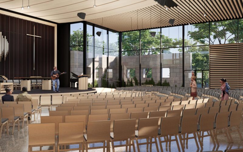 View from left side of Chapel interior showing layered seating, glass walls, and preserved stone garden structure.