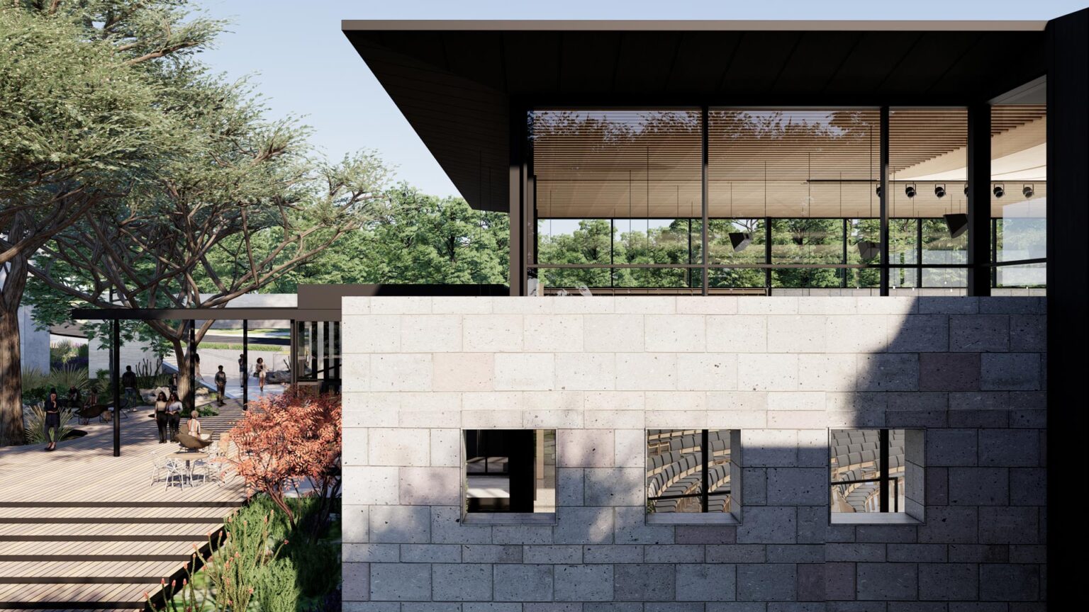View of Concordia University Chapel showing preserved garden wall, Spanish live oak trees, and glass chapel volume above.