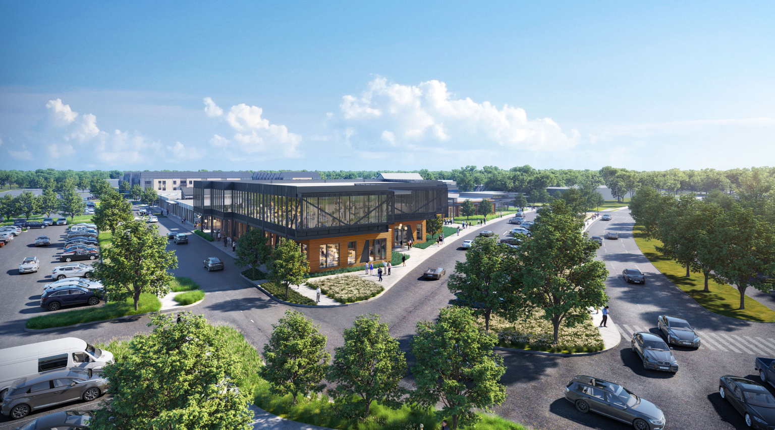 Aerial rendering of a two-story office and restaurant building at Assembly Park in Plano, Texas, featuring expansive glass windows, a black metal screen wrapping the upper level, and wood-accented ground-floor retail. The building is surrounded by tree-lined streets, pedestrian walkways, and surface parking.
