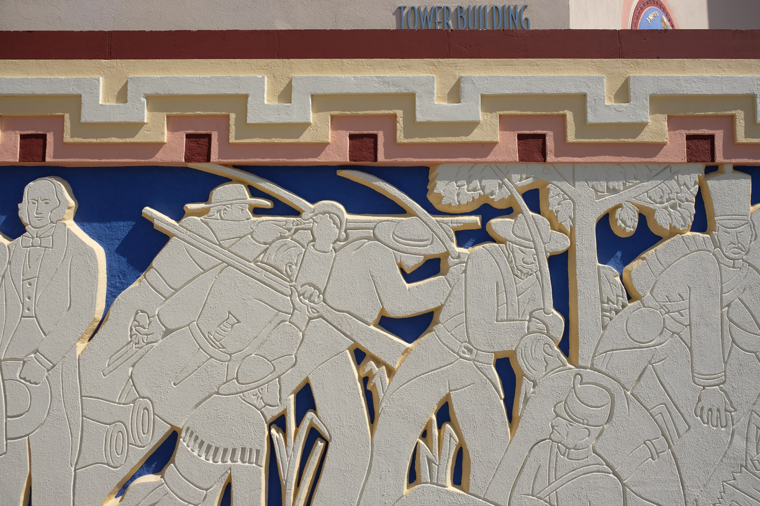 Close-up of the Greek key frieze and bas-relief depicting Texas history on the Fair Park Tower Building.