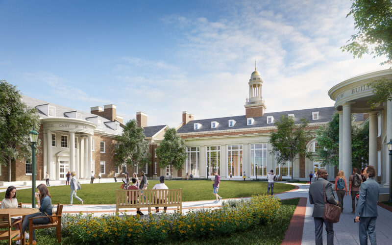 Courtyard of the Cox School of Business at Southern Methodist University featuring classical architectural columns, manicured landscaping, and students enjoying the outdoor space.