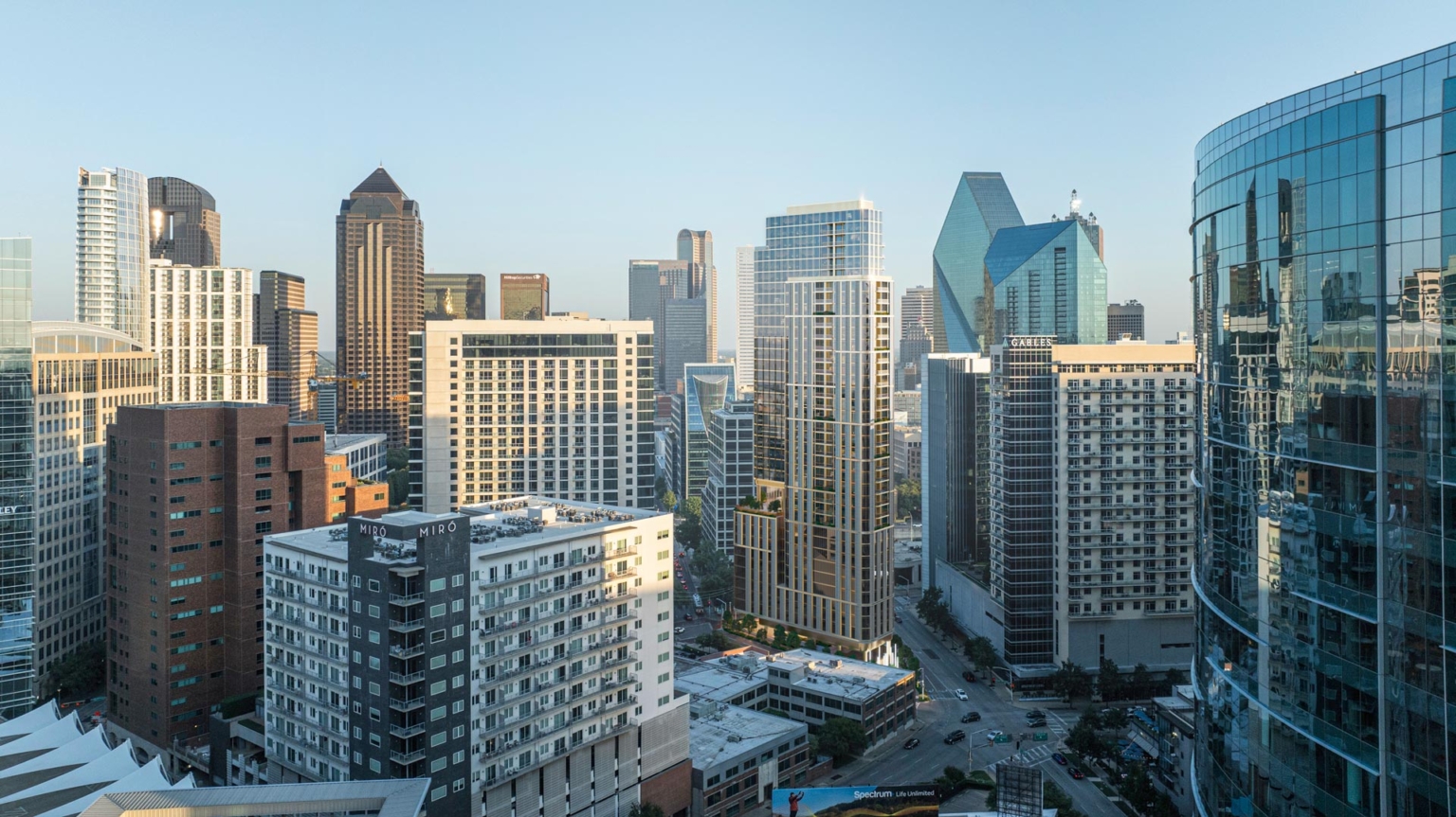 Aerial rendering of the Dallas skyline showing 1899 McKinney Avenue high-rise within the Uptown and Downtown core, highlighting its vertical profile and zoning-driven form.
