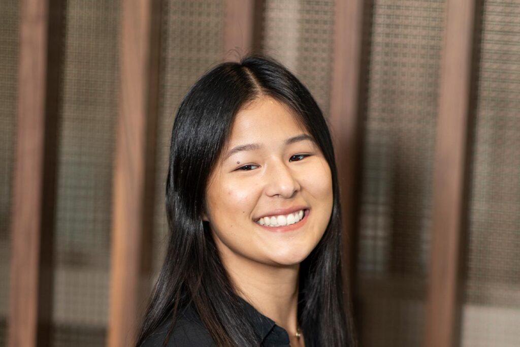Kaitlin Salanski, Architectural Professional in GFF’s Dallas office, close-up professional portrait in a modern workplace setting.
