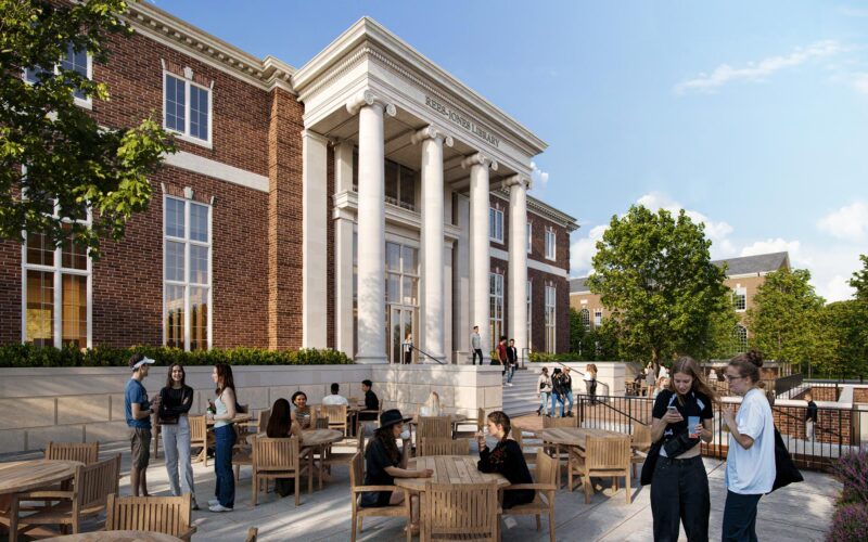 Perspective of red brick and limestone library with classical portico and students gathered on an outdoor terrace.