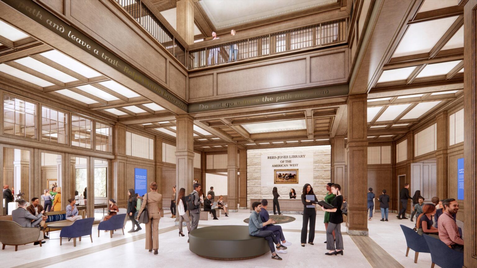 Double-height library lobby with wood coffered ceilings, balconies, seating areas, and “Rees-Jones Library of the American West” stone wall.
