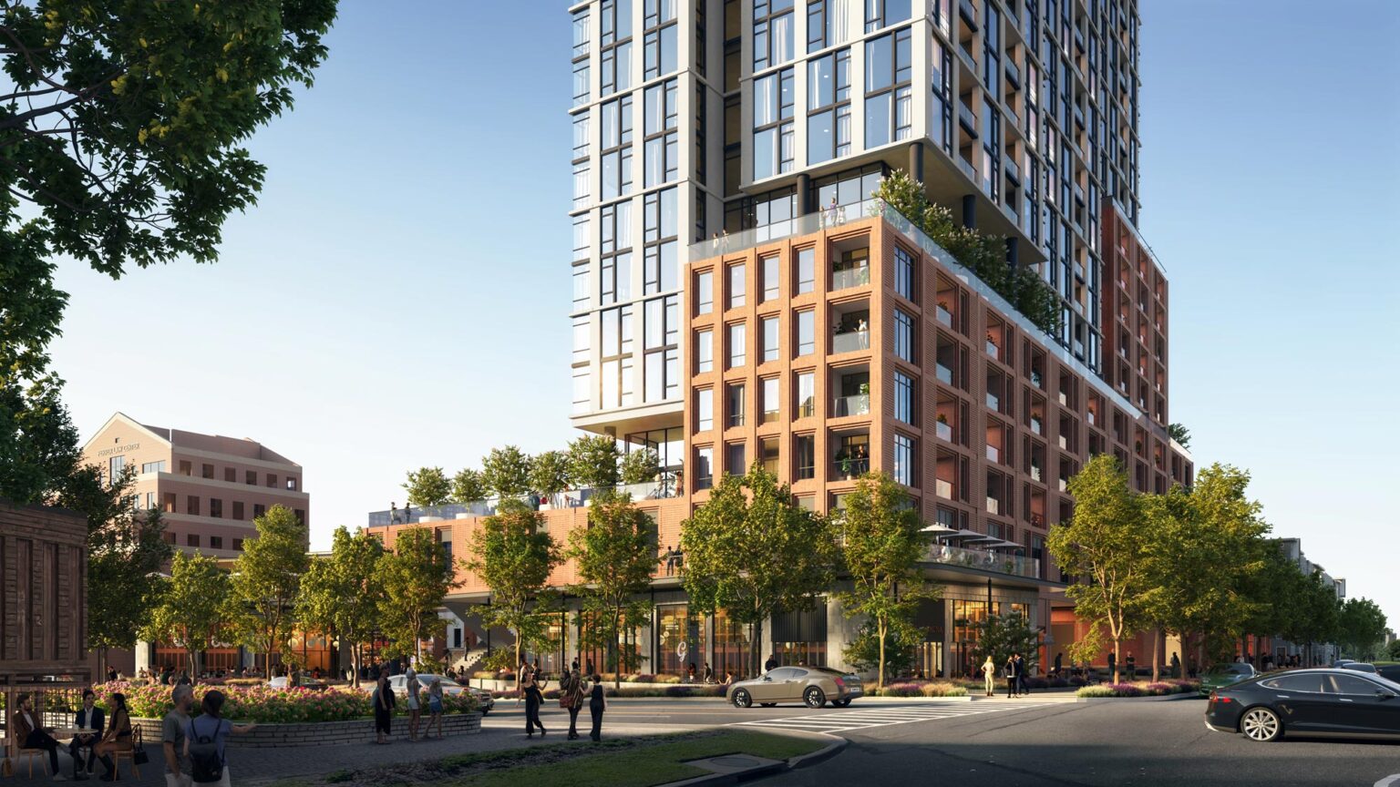 Corner view of 2615 Oak Lawn from the intersection, showing stepped terraces and pedestrian traffic.