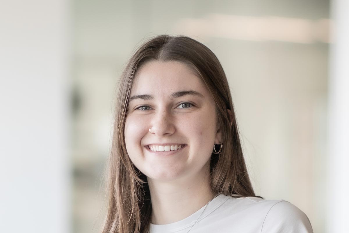 Allison Brooks, Architectural Intern in GFF’s Mixed-Use and Multifamily studio, close-up portrait in soft daylight.