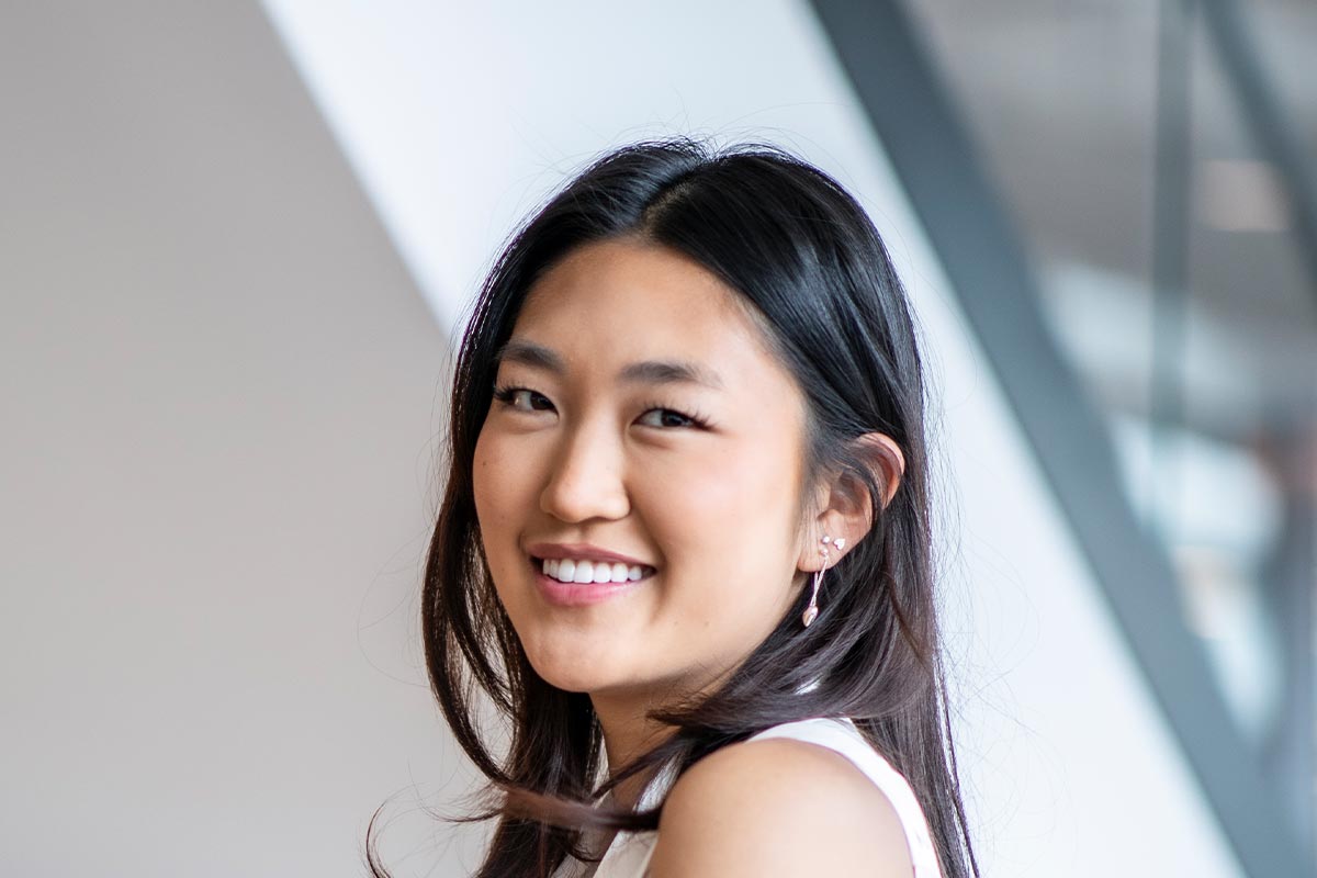 Amanda Choi, GFF Architectural Professional in Dallas, close-up professional portrait at a modern workplace design firm.