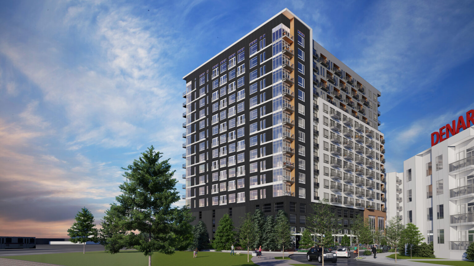 Denargo Market Phase 4 high-rise mixed-use residential tower in Denver’s RiNo neighborhood, featuring dark and light masonry with balconies above a parking podium.
