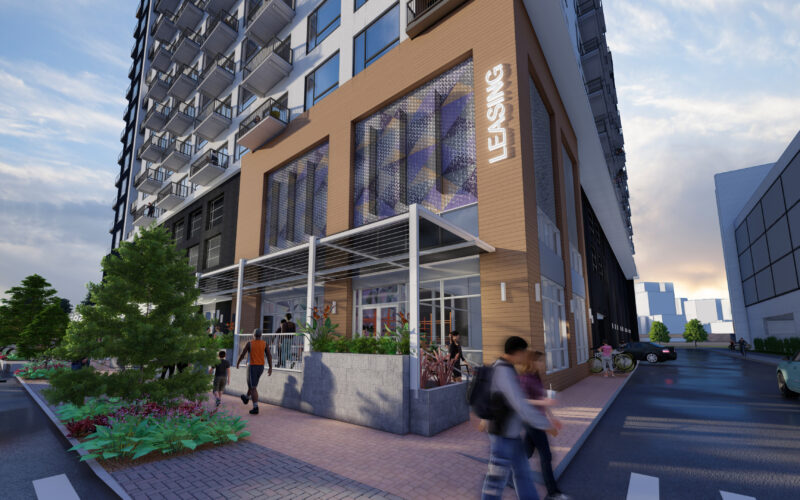 Street-level perspective of Denargo Market Phase 4 with leasing office and retail storefront, wood-look siding, and pedestrian-friendly design in Denver’s RiNo district.