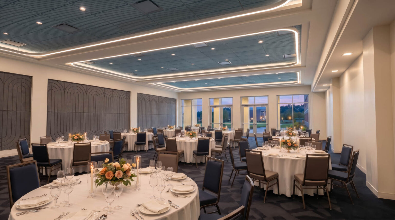Multi-purpose event room at the State Fair of Texas Administration Building set for a banquet with Art Deco inspired wall panels, blue ceiling, and perimeter lighting.