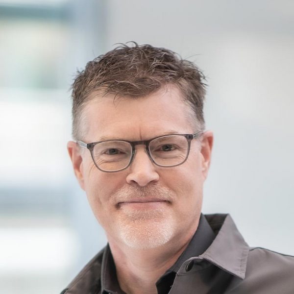Brian Moore, Principal and Director of Planning at GFF, close-up portrait with glasses and soft background light in the office.